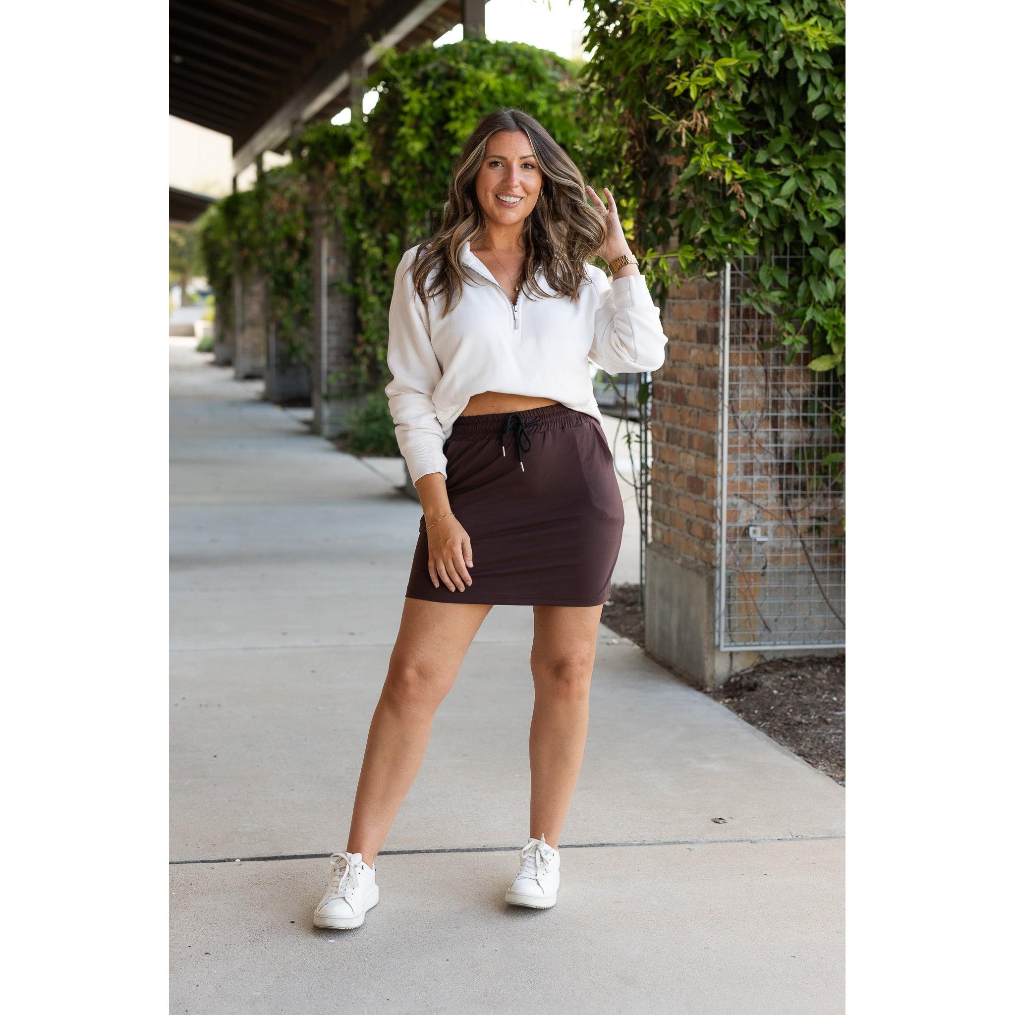 Julia Rose Bridget Brown Jogger Skirt women’s boutique midi skirt front view, Woman wearing Julia Rose Bridget jogger style brown skirt