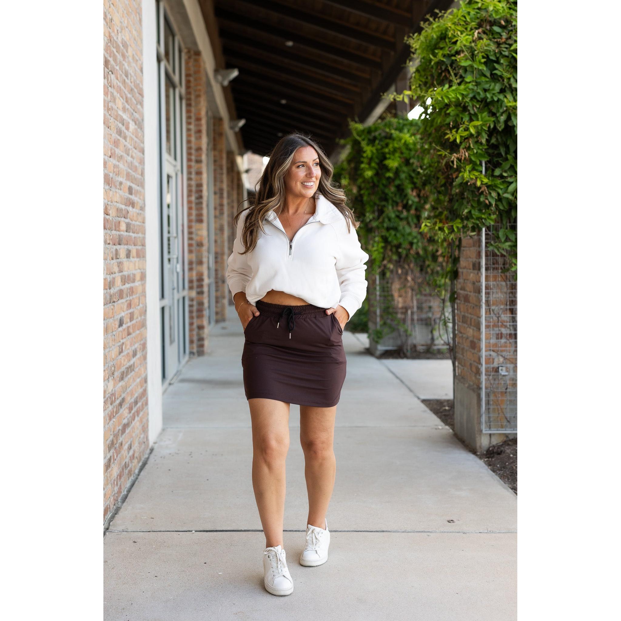 Julia Rose Bridget Brown Jogger Skirt women’s boutique midi skirt front view, Woman wearing Julia Rose Bridget jogger style brown skirt