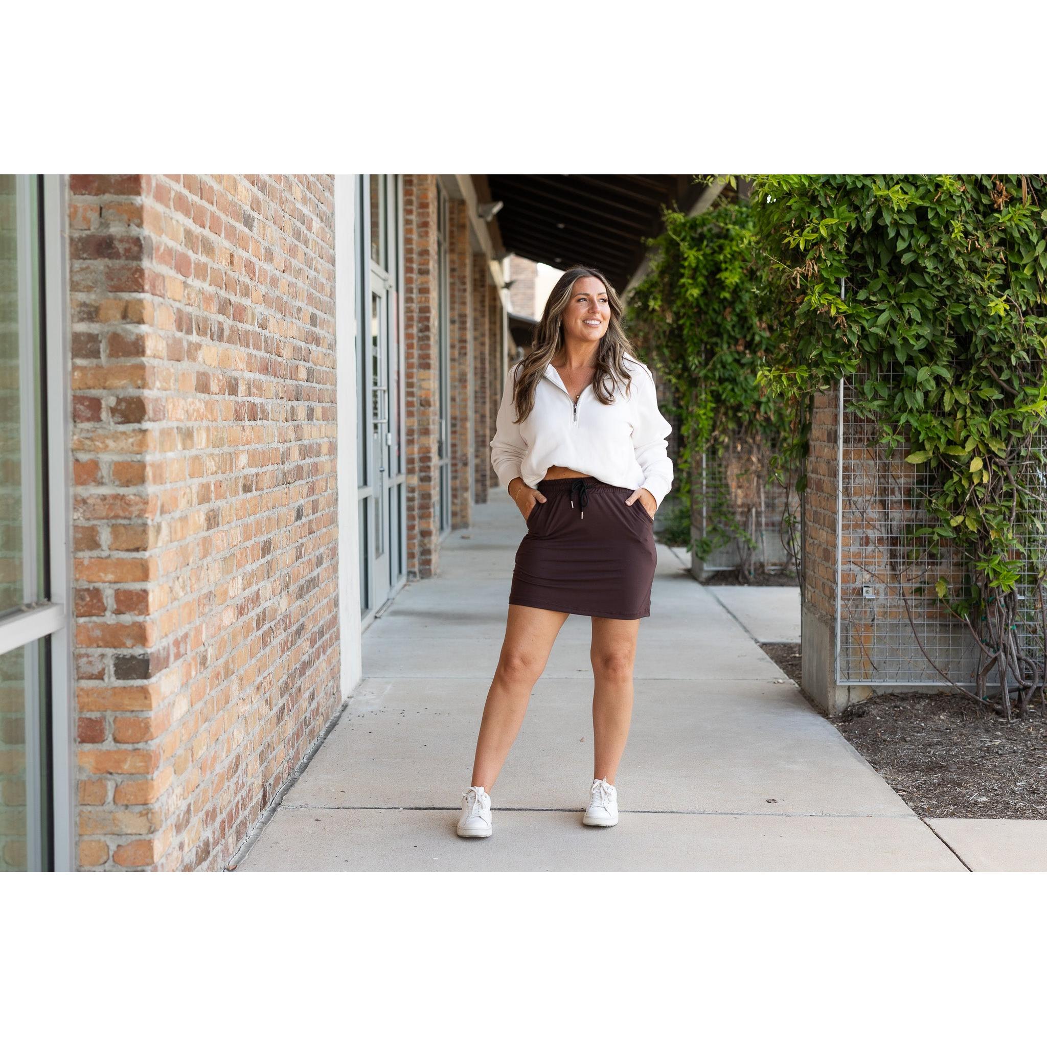 Julia Rose Bridget Brown Jogger Skirt women’s boutique midi skirt front view, Woman wearing Julia Rose Bridget jogger style brown skirt