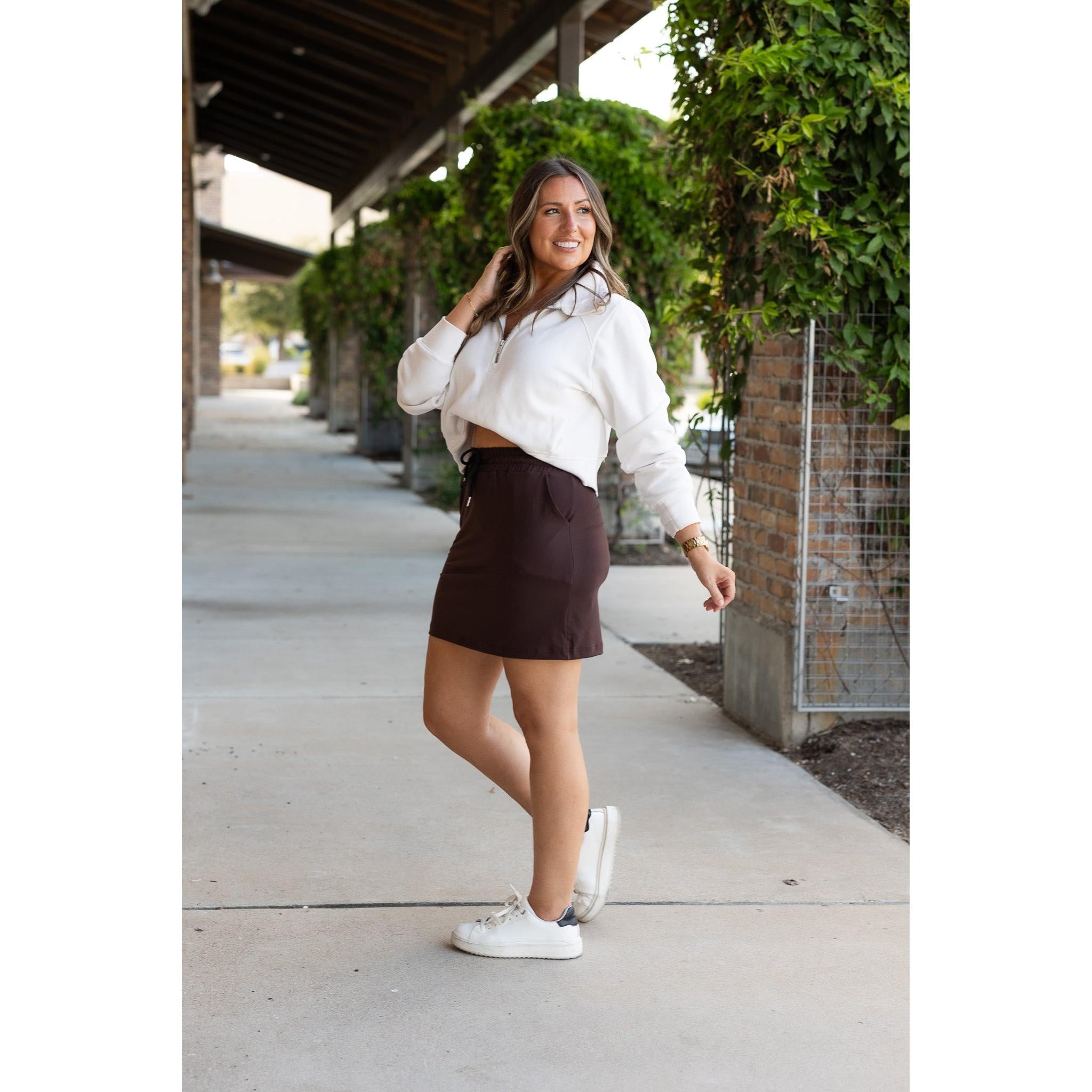 Julia Rose Bridget Brown Jogger Skirt women’s boutique midi skirt front view, Woman wearing Julia Rose Bridget jogger style brown skirt
