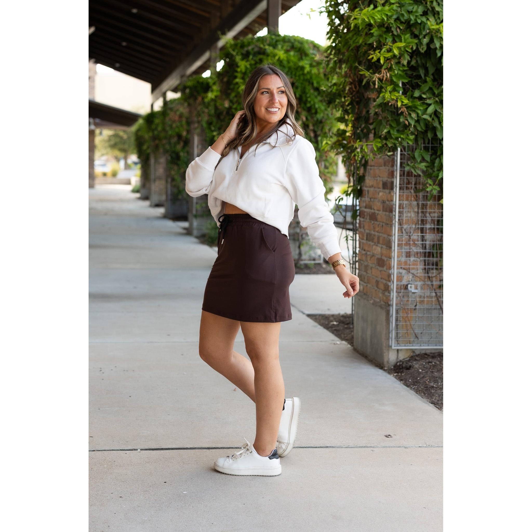 Julia Rose Bridget Brown Jogger Skirt women’s boutique midi skirt front view, Woman wearing Julia Rose Bridget jogger style brown skirt