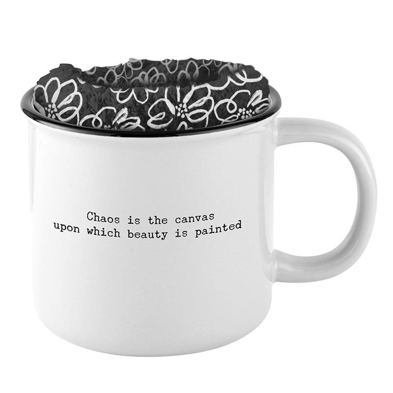 White mug with floral patterned interior, black interior, and text on a white background