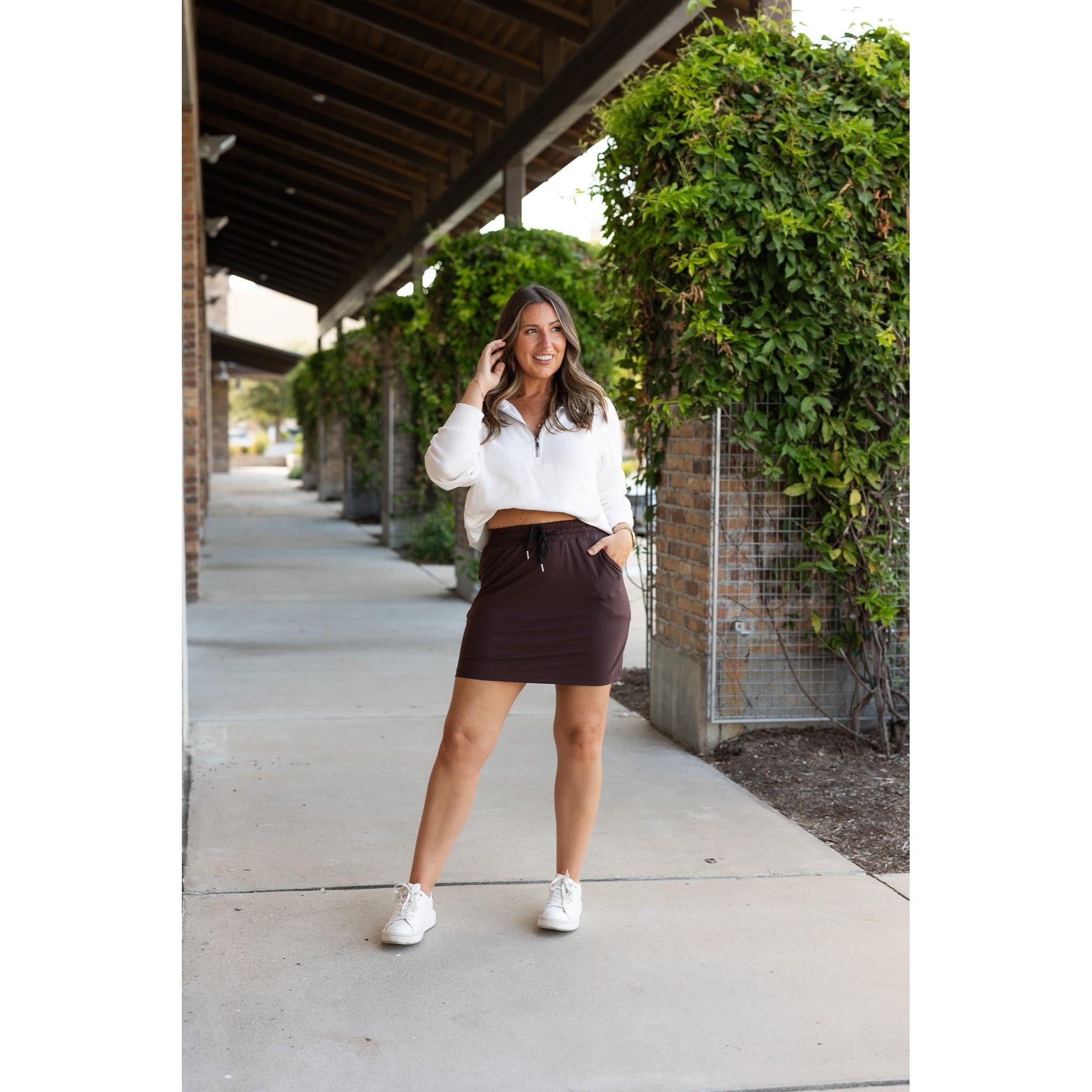 Julia Rose Bridget Brown Jogger Skirt women’s boutique midi skirt front view, Woman wearing Julia Rose Bridget jogger style brown skirt