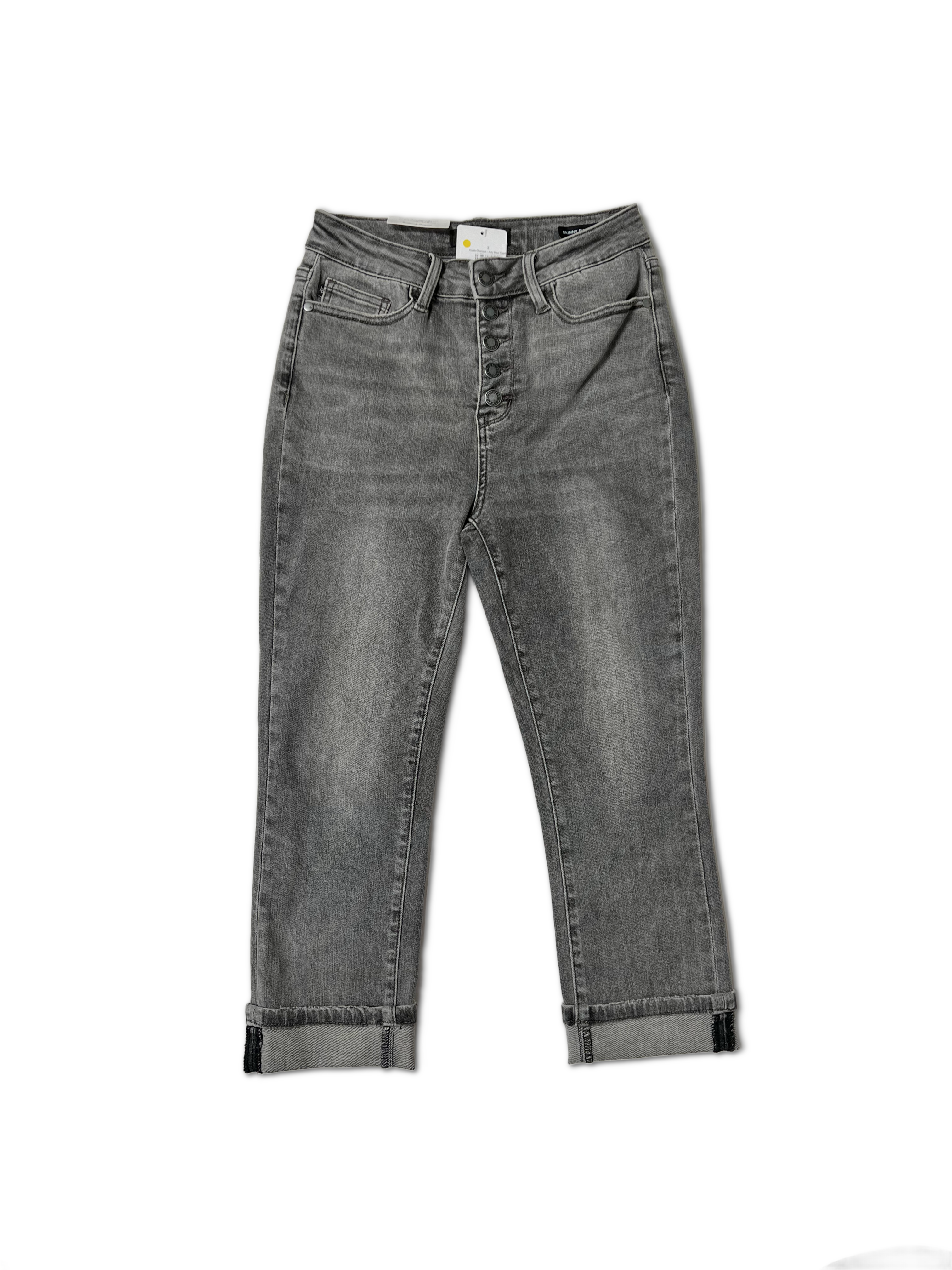 A pair of Dusty Charcoal - Judy Blue Capris by JB Boutique Simplified, high-waisted with a button fly. These non-distressed jeans feature a slight fading effect and are cuffed at the ankles. They are laid flat on a white background, showcasing the front view and pocket details.