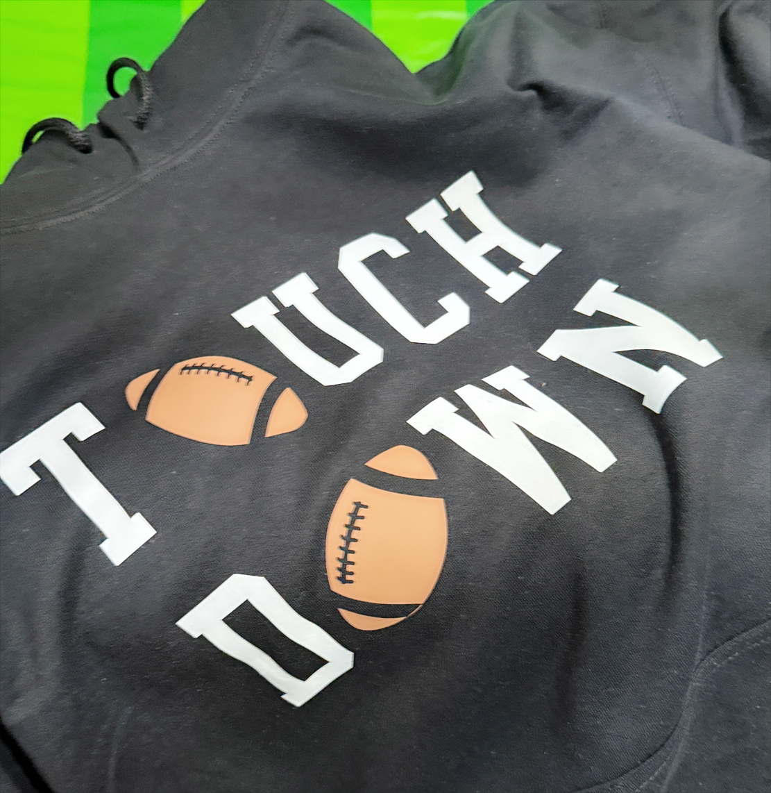 Touchdown Hoodie – Black Pullover with Bold Football Graphic