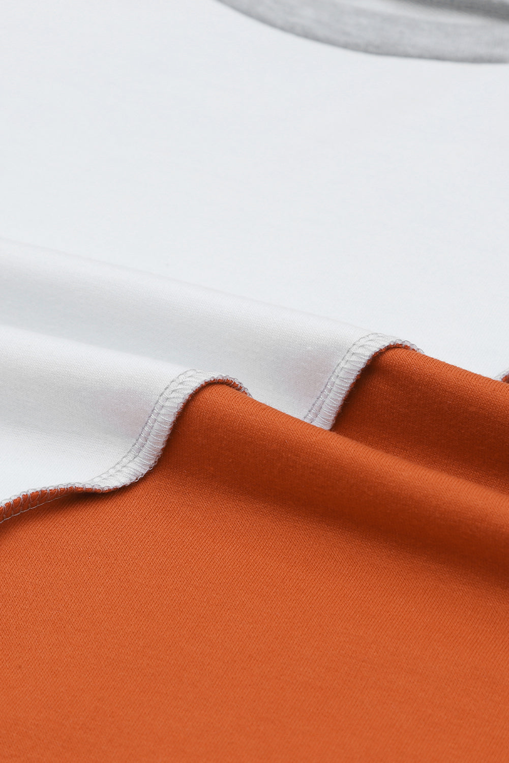 PRE-ORDER: Colorblock Stitching Irregular Hem Long Sleeve Top