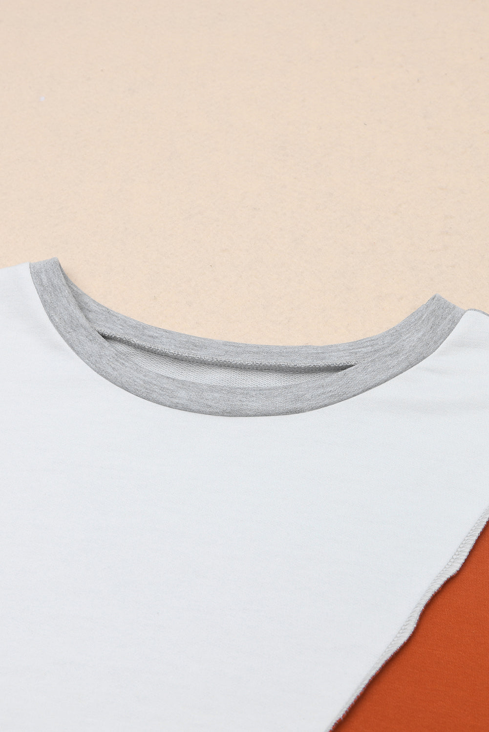 PRE-ORDER: Colorblock Stitching Irregular Hem Long Sleeve Top