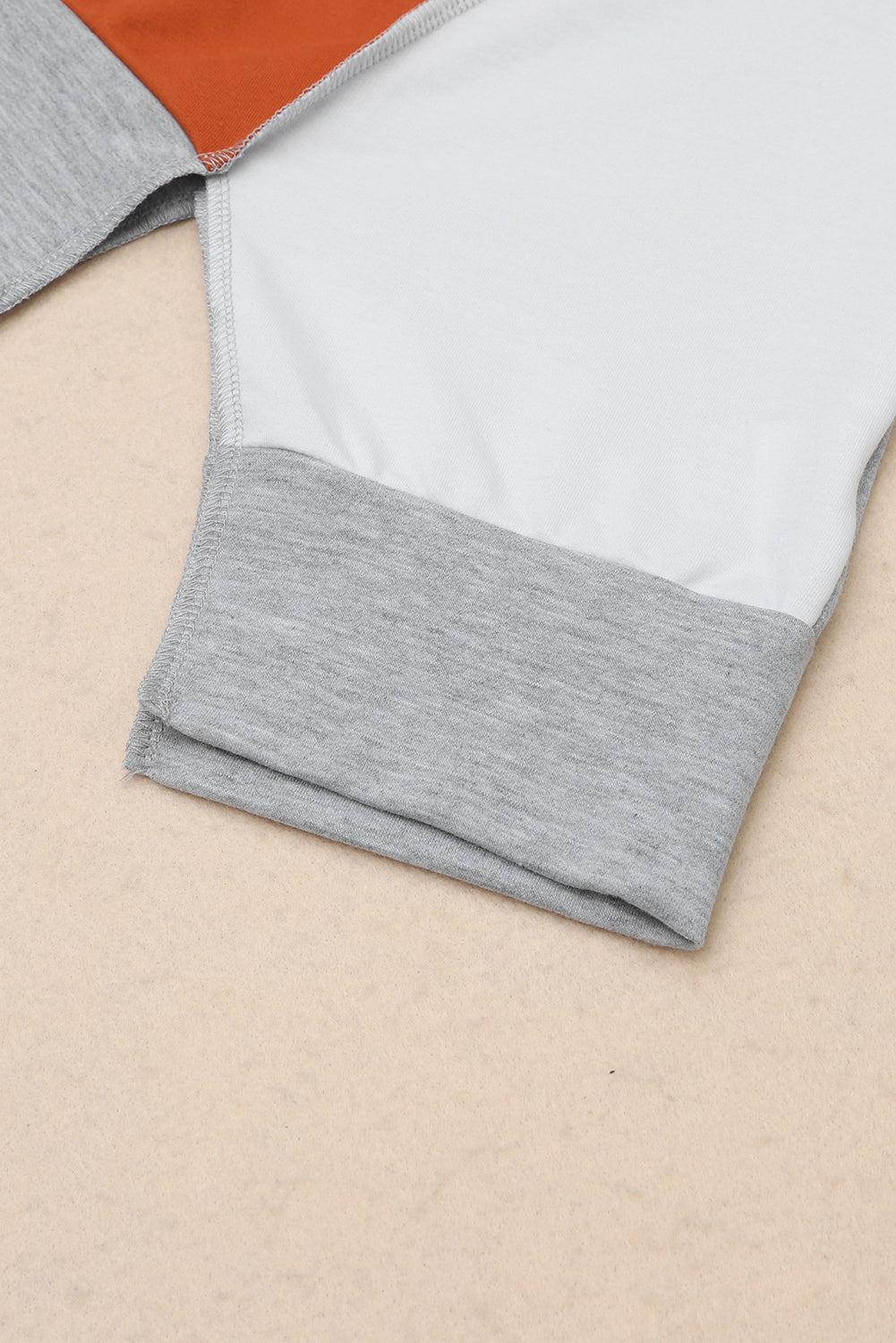 PRE-ORDER: Colorblock Stitching Irregular Hem Long Sleeve Top