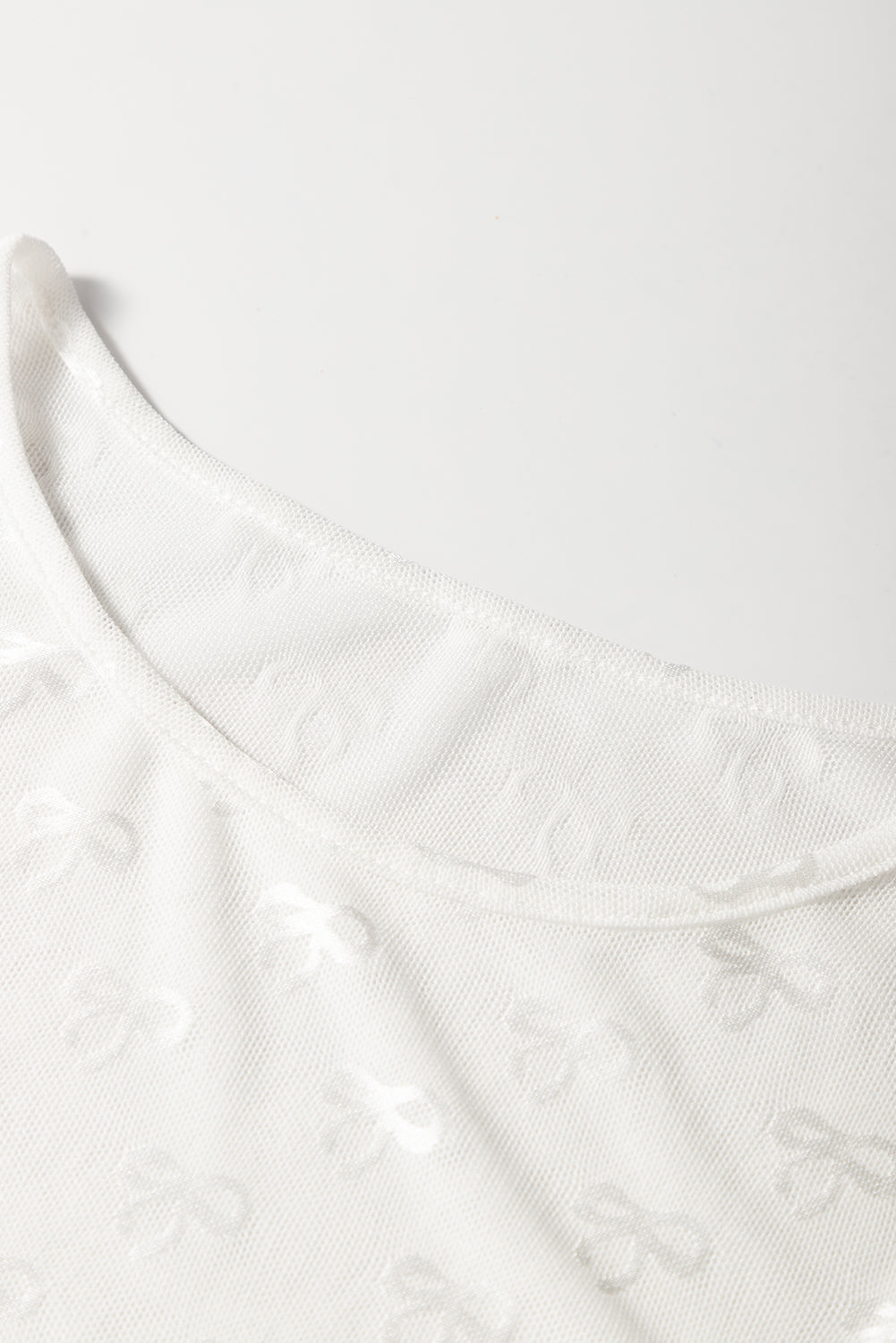 PRE-ORDER: Bow Pattern Long Sleeve Slim Fit Mesh Top