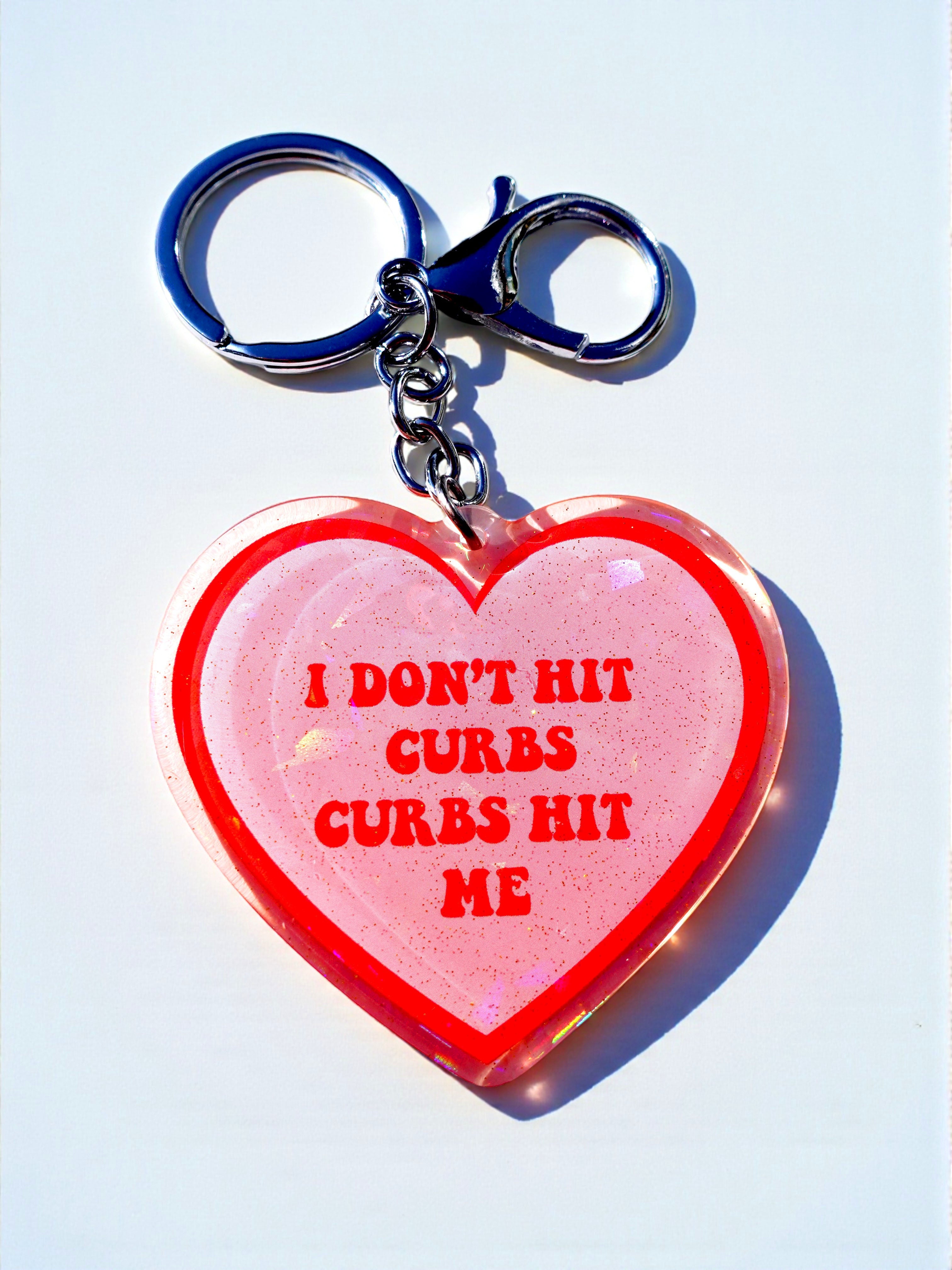 I Don't Hit Curbs Curbs Hit Me Holographic Heart Keychain